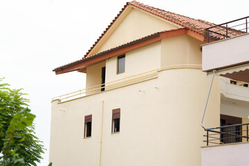 Modern apartment building in Mediterranean style in Albania on the sea coast. Concept of selling a house abroad, renting apartments
