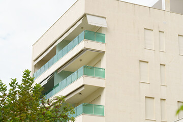 Modern minimalist apartment building in Mediterranean style in Albania on the sea coast. Concept of selling a house abroad, renting apartments