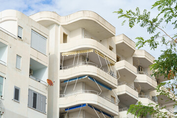 Modern apartment building in Mediterranean style in Albania on the sea coast. Concept of selling a house abroad, renting apartments