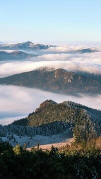 timelapse of foggy clouds moving in alps valley at