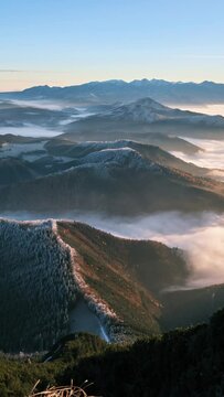 timelapse of foggy clouds moving in alps valley at