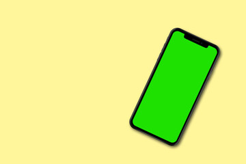 Mockup smart phone on Green screen Transparent and Clipping Path isolated for Infographic Business web site design app on a light yellow background.