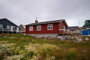 A typical colorful residential house in Greenland in a small settlement