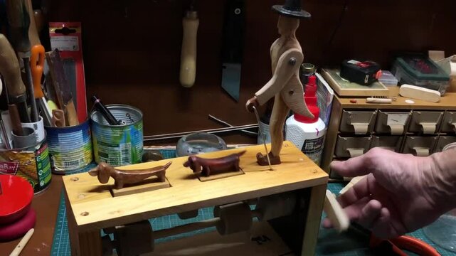 gentleman in a hat with two dachshunds, automaton
