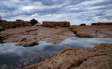 Obraz premium Rocks on the coast in Croatia, cloudy landscape
