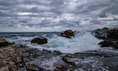 Beautiful seascape with rocks and stormy sky. Dubrovnik, Croatia
