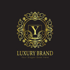 Letter Luxury brand logo design with a royal gold crown emblem and elegant typography
