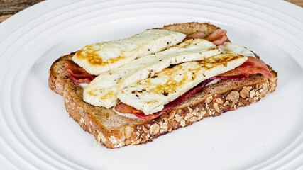 Delicious open-faced sandwich with cheese and meat