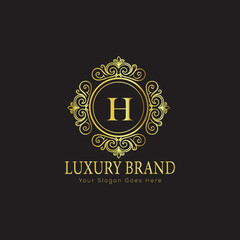 Letter Luxury brand logo design with a royal gold crown emblem and elegant typography
