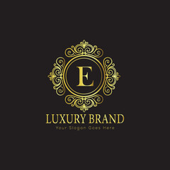 Letter Luxury brand logo design with a royal gold crown emblem and elegant typography
