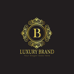 Letter Luxury brand logo design with a royal gold crown emblem and elegant typography
