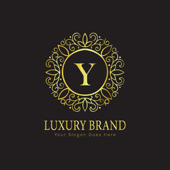 Letter Luxury brand logo design with a royal gold crown emblem and elegant typography
