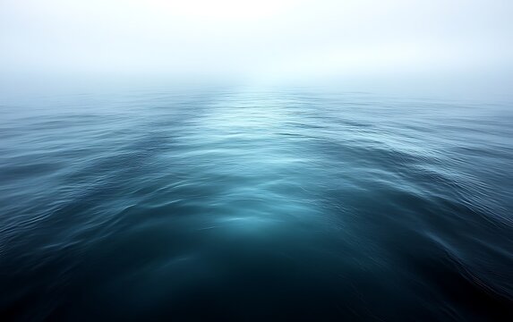 Misty ocean, calm sea, dark blue water.