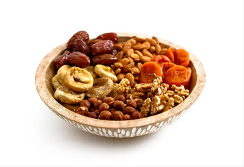Mixed nuts and dried fruits on a plate on a white background, copy space. Symbols of the Jewish holiday of Tu Bishvat Healthy snack