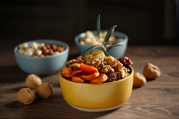 Dried fruits wooden spoon on white background with copy space. Symbols of Jewish holiday Tu Bishvat. Healthy snack - mix of organic dried fruits.