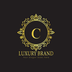 Letter Luxury brand logo design with a royal gold crown emblem and elegant typography
