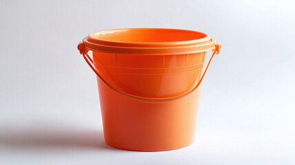 Orange plastic bucket isolated on white background. domestic household or housework equipment object, housekeeping hygiene service.