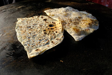 Traditional Turkish culinary delight, pancake made from hand-rolled dough. Turkish street delicacies. pastries. Fast food.
