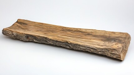 A rough hewn piece of wood on a white background.