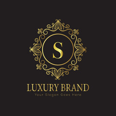Letter Luxury brand logo design with a royal gold crown emblem and elegant typography

