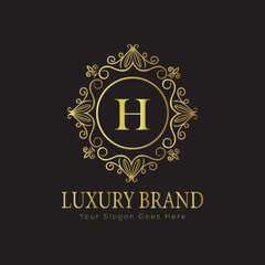 Letter Luxury brand logo design with a royal gold crown emblem and elegant typography

