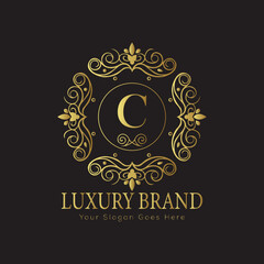 Letter Luxury brand logo design with a royal gold crown emblem and elegant typography

