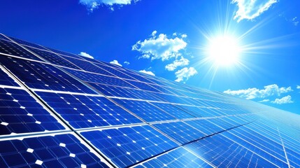 Solar panels under bright sky. Sunlight shines on photovoltaic panels.