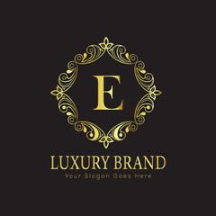 Letter Luxury brand logo design with a royal gold crown emblem and elegant typography
