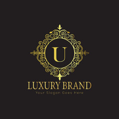 Letter Luxury brand logo design with a royal gold crown emblem and elegant typography

