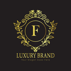 Letter Luxury brand logo design with a royal gold crown emblem and elegant typography
