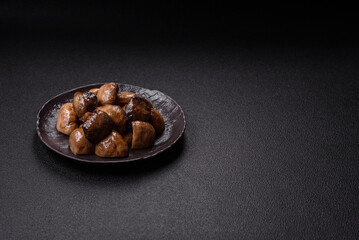 Grilled champignon mushrooms with salt, spices and herbs