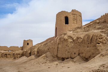 Panorama of the towers and walls of Sizan (Kheshti) Castle in Nushabad, Iran. Castle was built during the Seljuk period. Remains of traditional brick patterns can still be seen on the towers