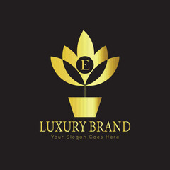 Letter luxury gold logo concept brand logo design with a royal gold crown emblem and elegant typography
