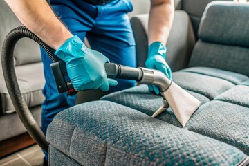 Technician Applying Cleaning Products to Remove Upholstery Stains