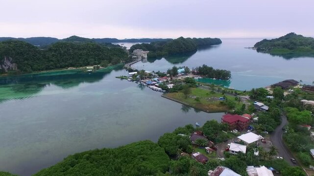 Cityscape of Koror island in Palau. Local Architecture and Buildings, Malakal Bridge, Hotels and Ocean in Background. Drone.