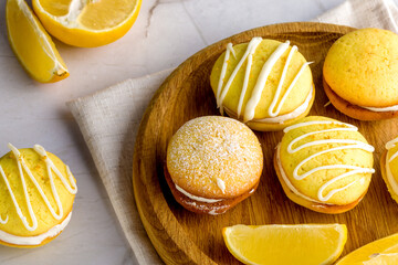 Homemade round lemon cookies. French sweet yellow cookies macarons
