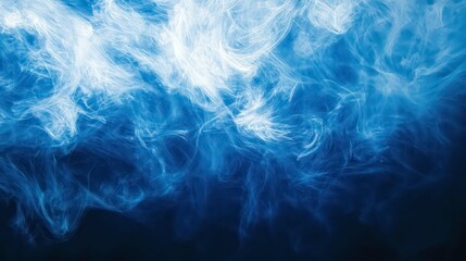 Obraz premium Abstract blue smoke swirls on black background.
