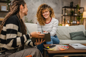 female architect help to her client to choice color for wall