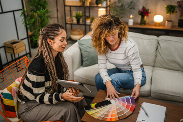 female architect help to her client to choice color for wall
