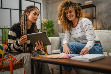 female architect help to her client to choice color for wall