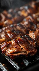 The image showcases a close up view of deliciously seared and charred pork ribs cooked to perfection on a grill or barbecue  The ribs are glistening with a savory