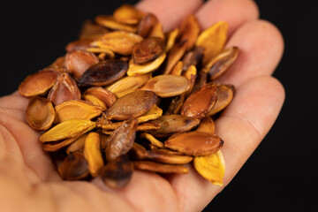 ripe pumpkin seeds fried to brown and golden