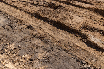 hole in the ground on the site of which a highway was started