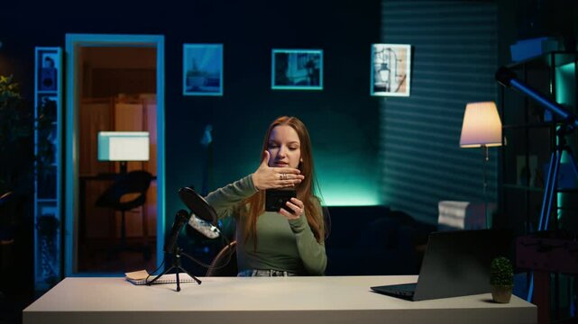 Tech expert holding V mount battery ensuring ample power to fuel production equipment, showing it to subscribers. Gen Z influencer vouching for professional charging device brand, camera B