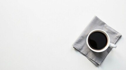 Aromatic Black Coffee in a Simple White Mug Resting on a Gray Napkin, a Minimalist Still Life Composition on a Pristine White Surface