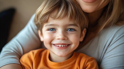 Happy little boy with mother in park. Mom holds son tightly. Boy smiling. Family time. Warm autumn day. Joyful moment. Care, love. Positive vibes. Close-up. Rehabilitation, support. Cute child with