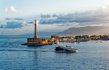 The Golden Madonna della Lettera statue and Liberty Lines Ferry