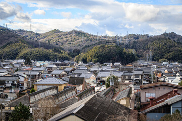 Naklejka premium Traditional Japanese Townscape with Mountain Backdrop, Izushi Castle Town, Toyooka, Japan