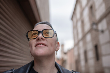 Lesbian woman with sunglasses and looking away with attitude