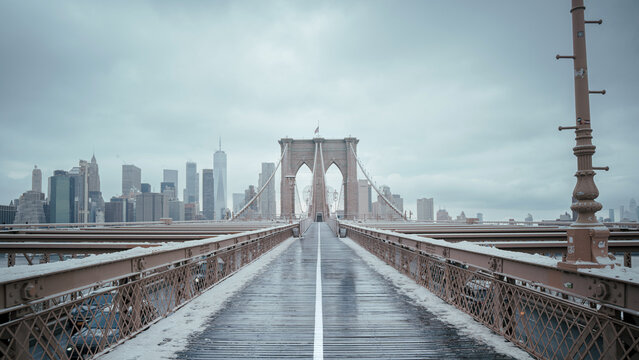 Fototapeta New York city Brooklyn bridge view with snow 